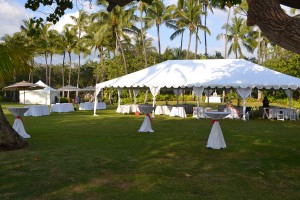 large white tent rental positioned on a lawn for an upcoming event